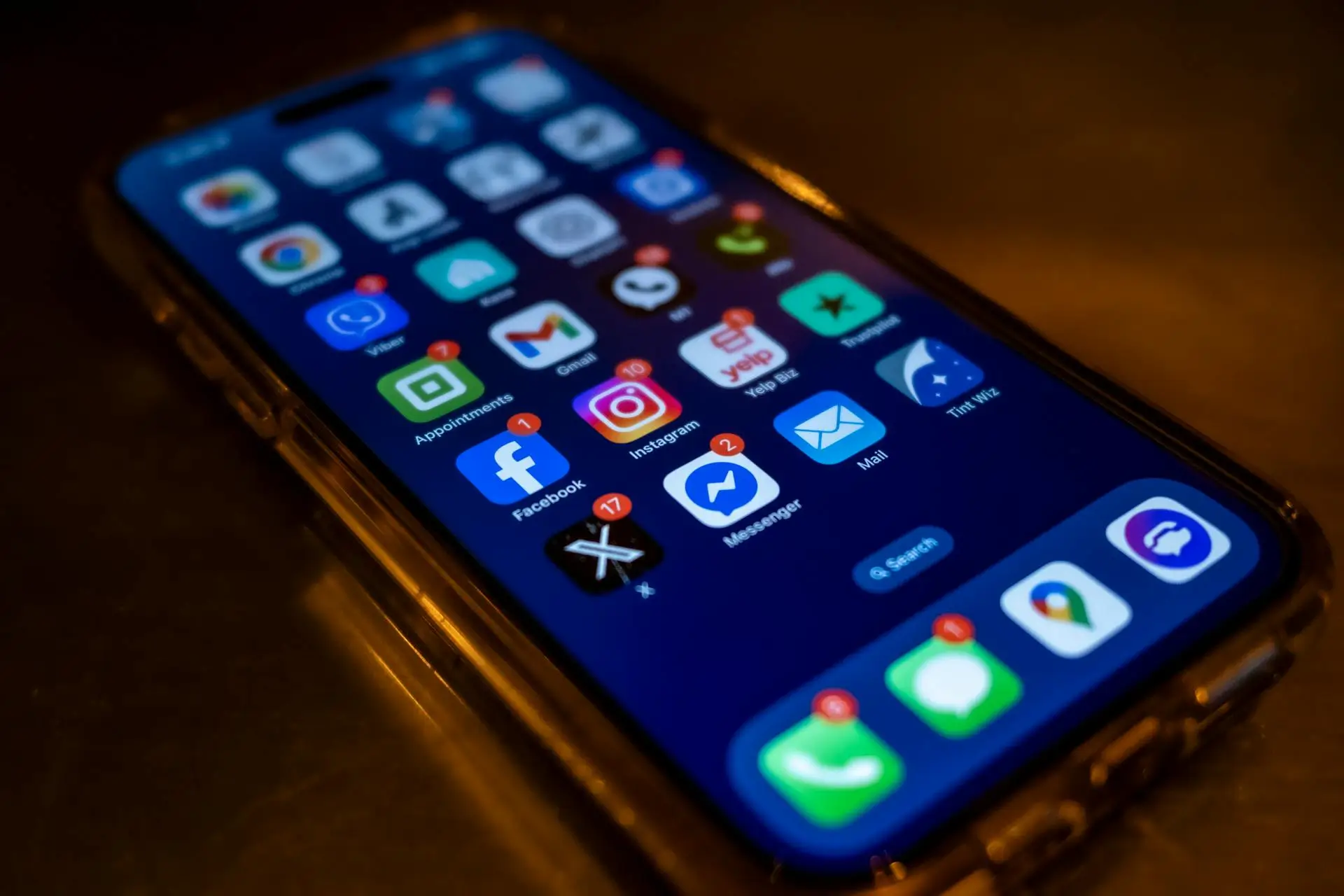 Social media notifications on phone screen representing overflowing DMs and missed leads.